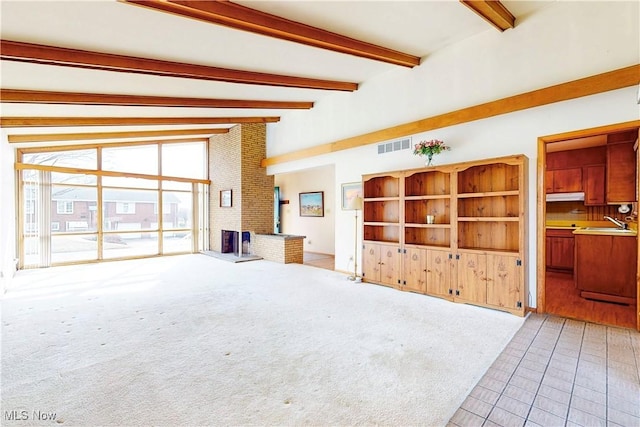2455 Alexander Mnr E, Steubenville, OH 43952 - unfurnished living room with beamed ceiling, tile patterned flooring, carpet, a fireplace, and high vaulted ceiling