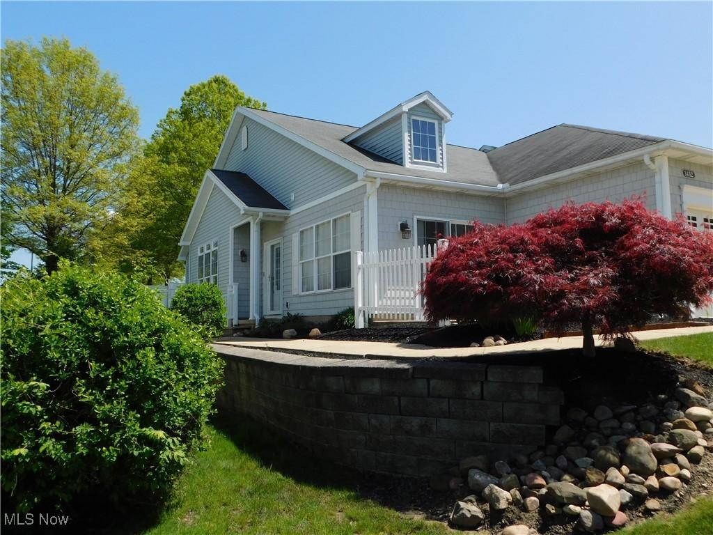 1432 Chesapeake Ave, Louisville, OH 44641 - view of property exterior with an attached garage
