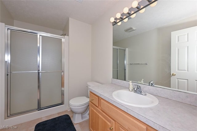 4212 Castle Rdg, Copley, OH 44321 - full bathroom with vanity, a shower with door, toilet, and tile patterned flooring