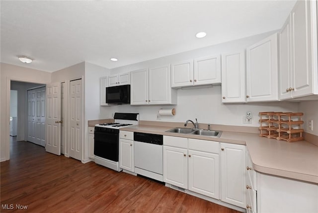 4212 Castle Rdg, Copley, OH 44321 - kitchen with white appliances, a sink, wood finished floors, white cabinets, and recessed lighting
