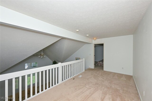 4212 Castle Rdg, Copley, OH 44321 - empty room with carpet, a ceiling fan, and a textured ceiling