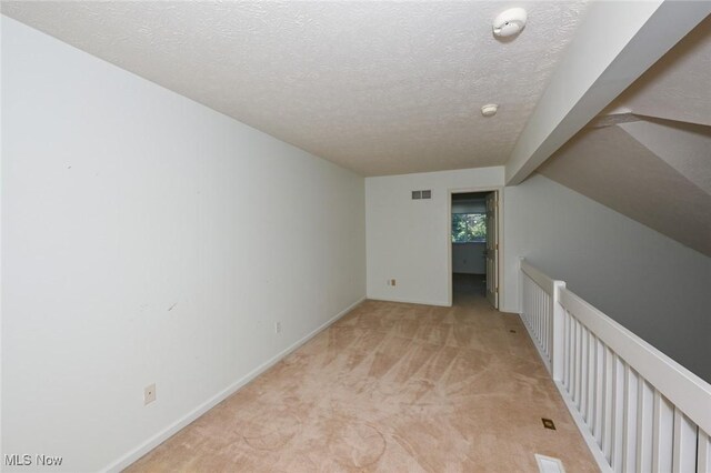 4212 Castle Rdg, Copley, OH 44321 - unfurnished room featuring light carpet, a textured ceiling, baseboards, and a smoke detector