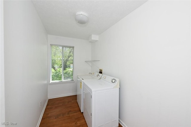 4212 Castle Rdg, Copley, OH 44321 - washroom featuring separate washer and dryer, baseboards, wood finished floors, and a textured ceiling