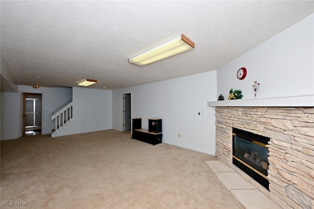 4212 Castle Rdg, Copley, OH 44321 - unfurnished living room featuring a stone fireplace, stairs, light carpet, and a textured ceiling