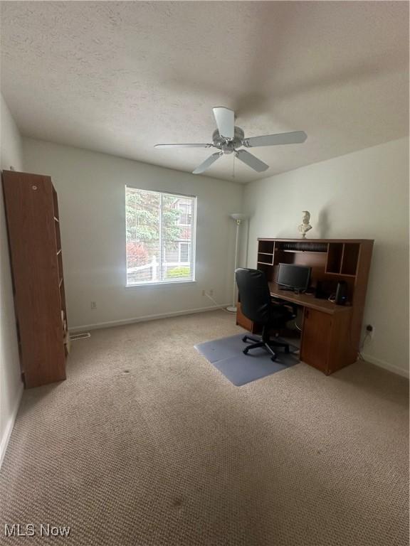 4212 Castle Rdg, Copley, OH 44321 - carpeted home office featuring baseboards, ceiling fan, and a textured ceiling