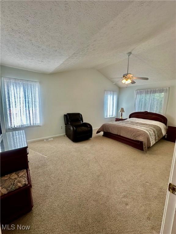 4212 Castle Rdg, Copley, OH 44321 - bedroom featuring carpet, a textured ceiling, lofted ceiling, ceiling fan, and baseboards