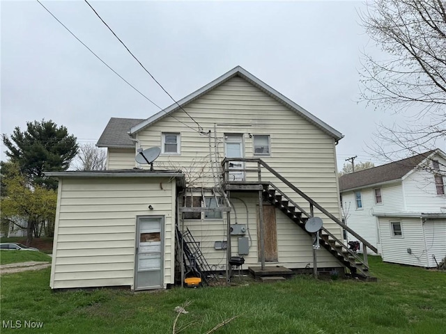871 Chestnut St, Coshocton, OH 43812 - back of house with a lawn and stairway