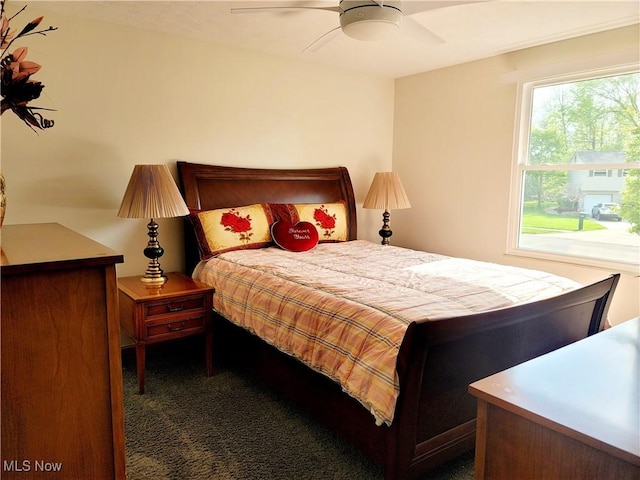 bedroom with carpet floors and a ceiling fan