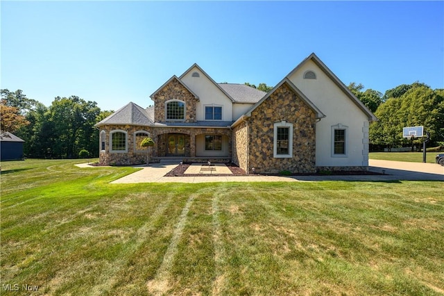 6240 Tim Dr, Wadsworth, OH 44281 - french country inspired facade with stucco siding, stone siding, and a front lawn