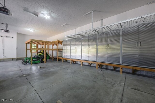 6240 Tim Dr, Wadsworth, OH 44281 - garage featuring a garage door opener