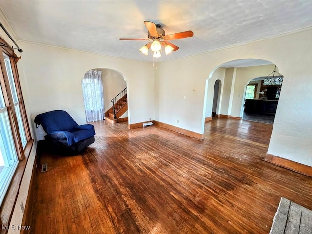 105 W 40th St, Shadyside, OH 43947 - unfurnished room featuring arched walkways, ceiling fan, wood-type flooring, and crown molding