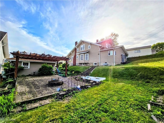 105 W 40th St, Shadyside, OH 43947 - rear view of house with a pergola, a fire pit, a patio, and a yard
