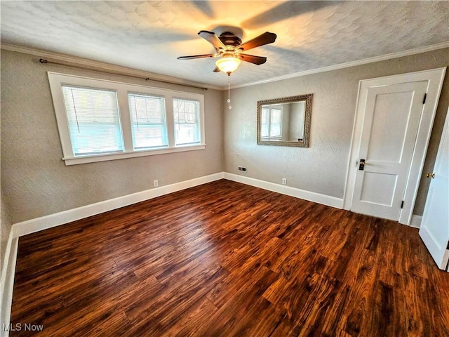105 W 40th St, Shadyside, OH 43947 - unfurnished room featuring dark wood-type flooring, ceiling fan, ornamental molding, baseboards, and a textured wall