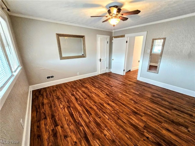 105 W 40th St, Shadyside, OH 43947 - unfurnished bedroom featuring wood finished floors, baseboards, crown molding, and ceiling fan