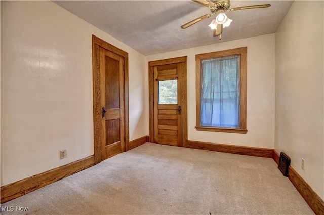 6456 Dover Zoar Rd NE, Dover, OH 44622 - carpeted empty room featuring baseboards and a ceiling fan