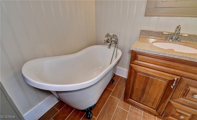 6456 Dover Zoar Rd NE, Dover, OH 44622 - full bathroom with vanity, a freestanding tub, and baseboards