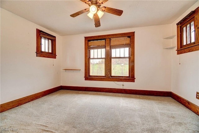 6456 Dover Zoar Rd NE, Dover, OH 44622 - carpeted empty room with healthy amount of natural light, baseboards, and ceiling fan