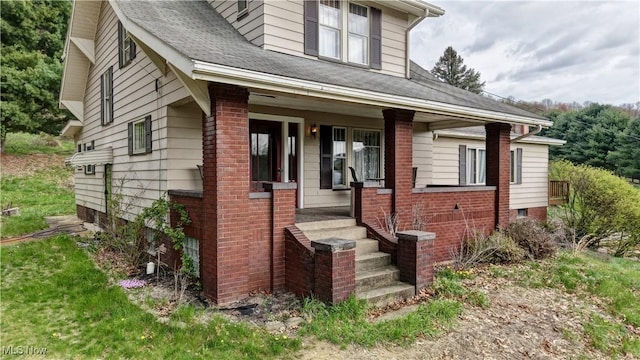6456 Dover Zoar Rd NE, Dover, OH 44622 - view of front of house featuring a porch and brick siding