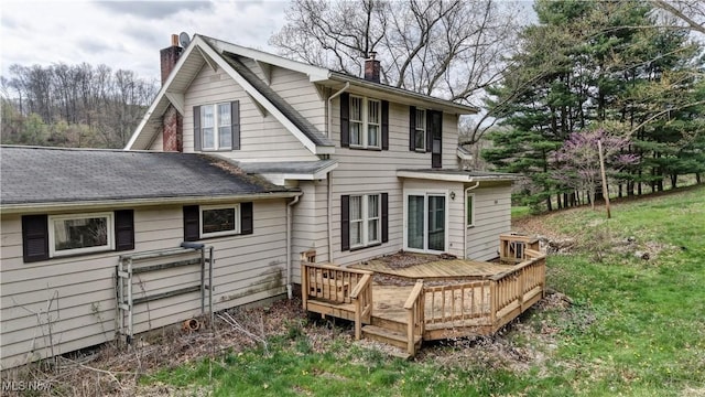 6456 Dover Zoar Rd NE, Dover, OH 44622 - back of property featuring a chimney, a deck, and roof with shingles