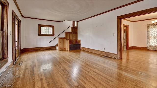 6456 Dover Zoar Rd NE, Dover, OH 44622 - unfurnished living room with crown molding, wood finished floors, stairway, and baseboards