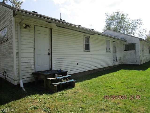 2817 Cemetery Rd, Ashtabula, OH 44004 - back of house with a yard