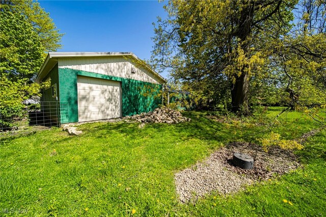 2226 W 13th St, Ashtabula, OH 44004 - view of yard featuring an outbuilding and a detached garage