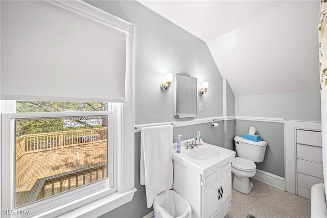 2226 W 13th St, Ashtabula, OH 44004 - bathroom featuring lofted ceiling, toilet, vanity, and baseboards