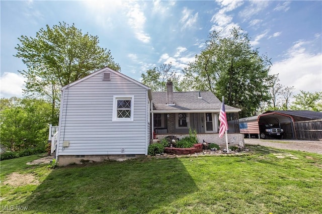 2229 41st St NW, Canton, OH 44709 - view of front of house featuring a carport, a front lawn, a chimney, and dirt driveway