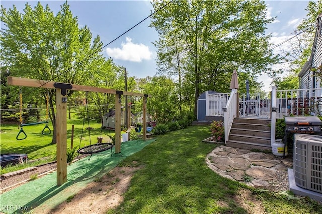 2229 41st St NW, Canton, OH 44709 - view of yard with a storage unit, an outbuilding, a wooden deck, and central air condition unit