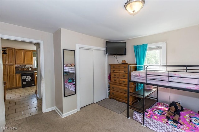 2229 41st St NW, Canton, OH 44709 - bedroom with light carpet, a closet, and baseboards