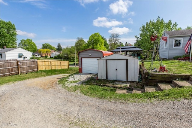 2229 41st St NW, Canton, OH 44709 - view of shed with fence and dirt driveway