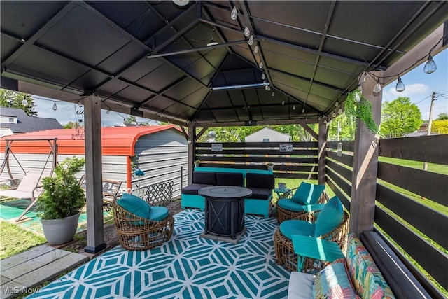 2229 41st St NW, Canton, OH 44709 - view of patio featuring a gazebo, a shed, an outdoor hangout area, an outbuilding, and fence