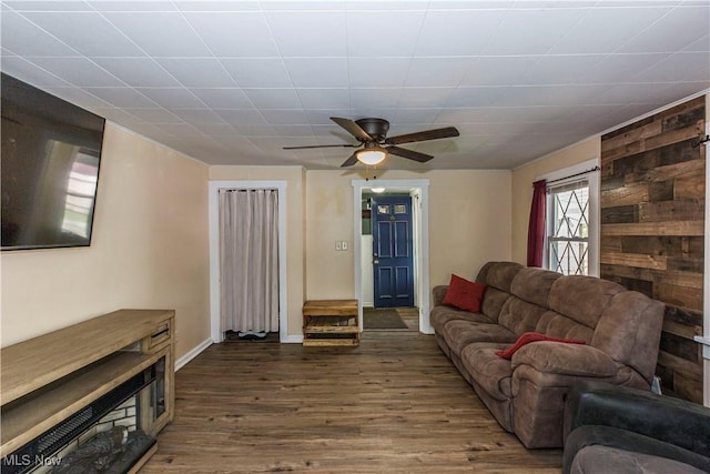 2229 41st St NW, Canton, OH 44709 - living area with wood finished floors, a ceiling fan, and baseboards