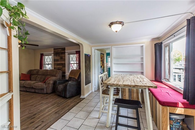 2229 41st St NW, Canton, OH 44709 - dining space featuring crown molding and light wood finished floors