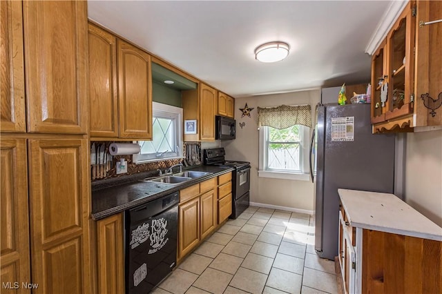 2229 41st St NW, Canton, OH 44709 - kitchen featuring black appliances, a sink, and brown cabinetry