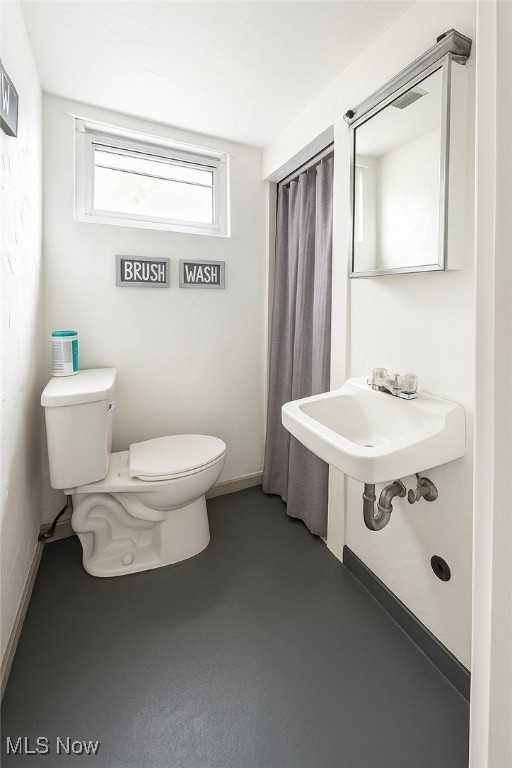 bathroom featuring toilet