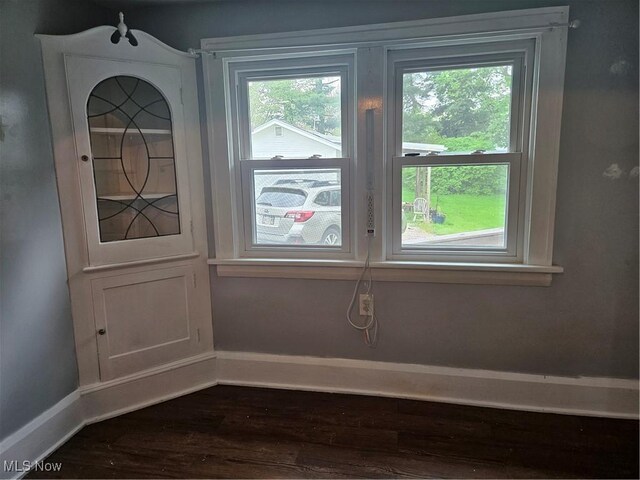 825 Summit St, Salem, OH 44460 - doorway to outside featuring baseboards and dark wood finished floors