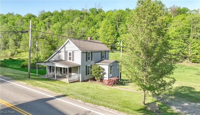 59969 Somerton Hwy, Barnesville, OH 43713 - view of front of property with a view of trees and a front yard