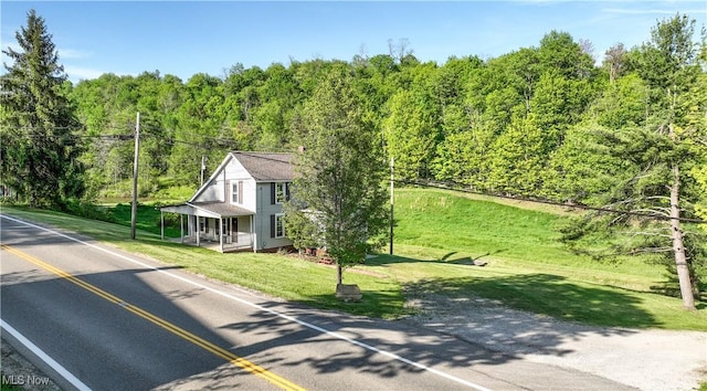 59969 Somerton Hwy, Barnesville, OH 43713 - view of asphalt road with a wooded view