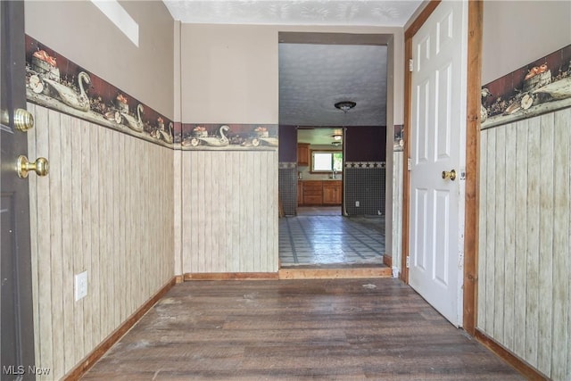 59969 Somerton Hwy, Barnesville, OH 43713 - corridor featuring wood finished floors, baseboards, and wooden walls