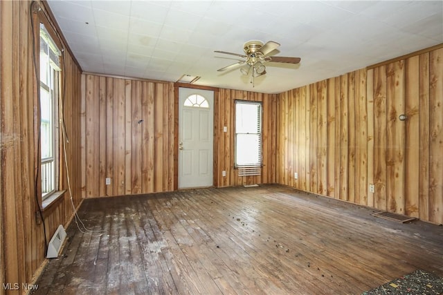 59969 Somerton Hwy, Barnesville, OH 43713 - spare room with wood-type flooring, ceiling fan, and wooden walls