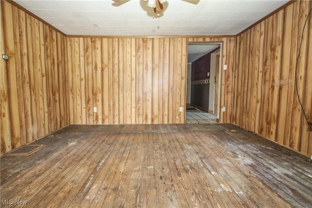 59969 Somerton Hwy, Barnesville, OH 43713 - spare room with hardwood / wood-style flooring, ceiling fan, and wooden walls