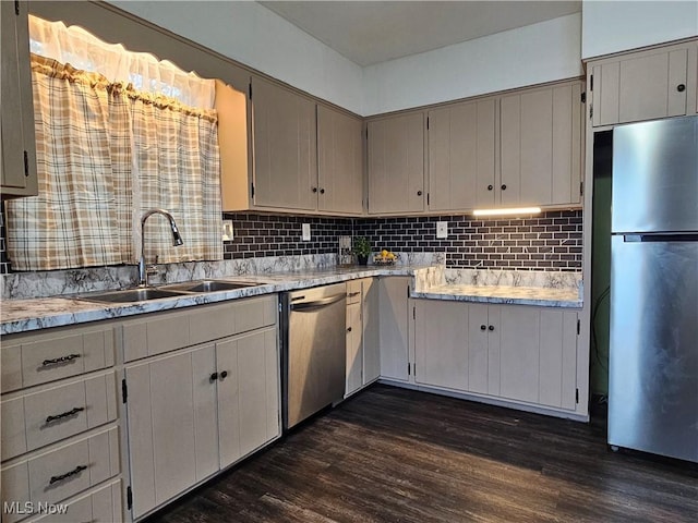 164 W High St, New Concord, OH 43762 - kitchen featuring stainless steel appliances, a sink, dark wood-type flooring, and tasteful backsplash