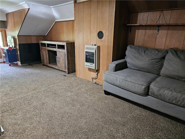 164 W High St, New Concord, OH 43762 - living room with heating unit, wooden walls, carpet floors, and vaulted ceiling