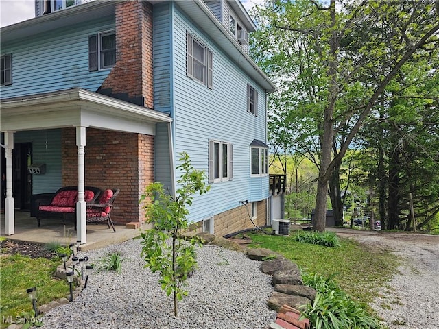 164 W High St, New Concord, OH 43762 - view of side of home with cooling unit