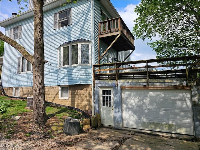 164 W High St, New Concord, OH 43762 - rear view of property featuring a balcony and central AC