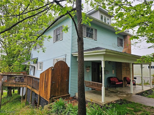 164 W High St, New Concord, OH 43762 - back of house with a gate and a wooden deck