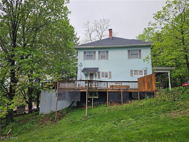 164 W High St, New Concord, OH 43762 - rear view of property featuring a deck, a chimney, and a yard