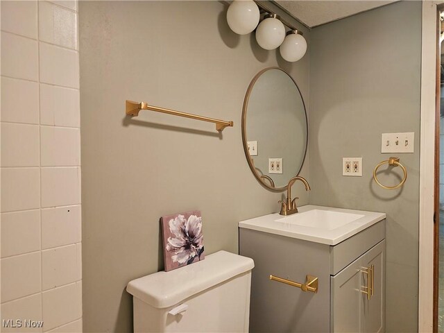 164 W High St, New Concord, OH 43762 - bathroom featuring toilet and vanity