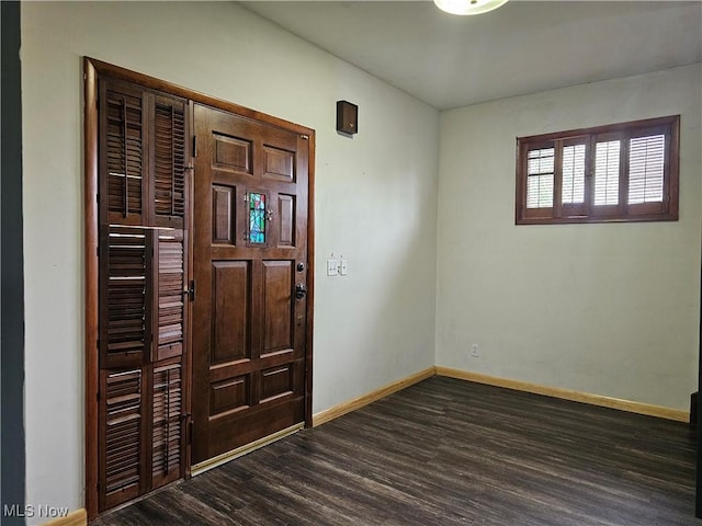 164 W High St, New Concord, OH 43762 - entryway with dark wood finished floors and baseboards